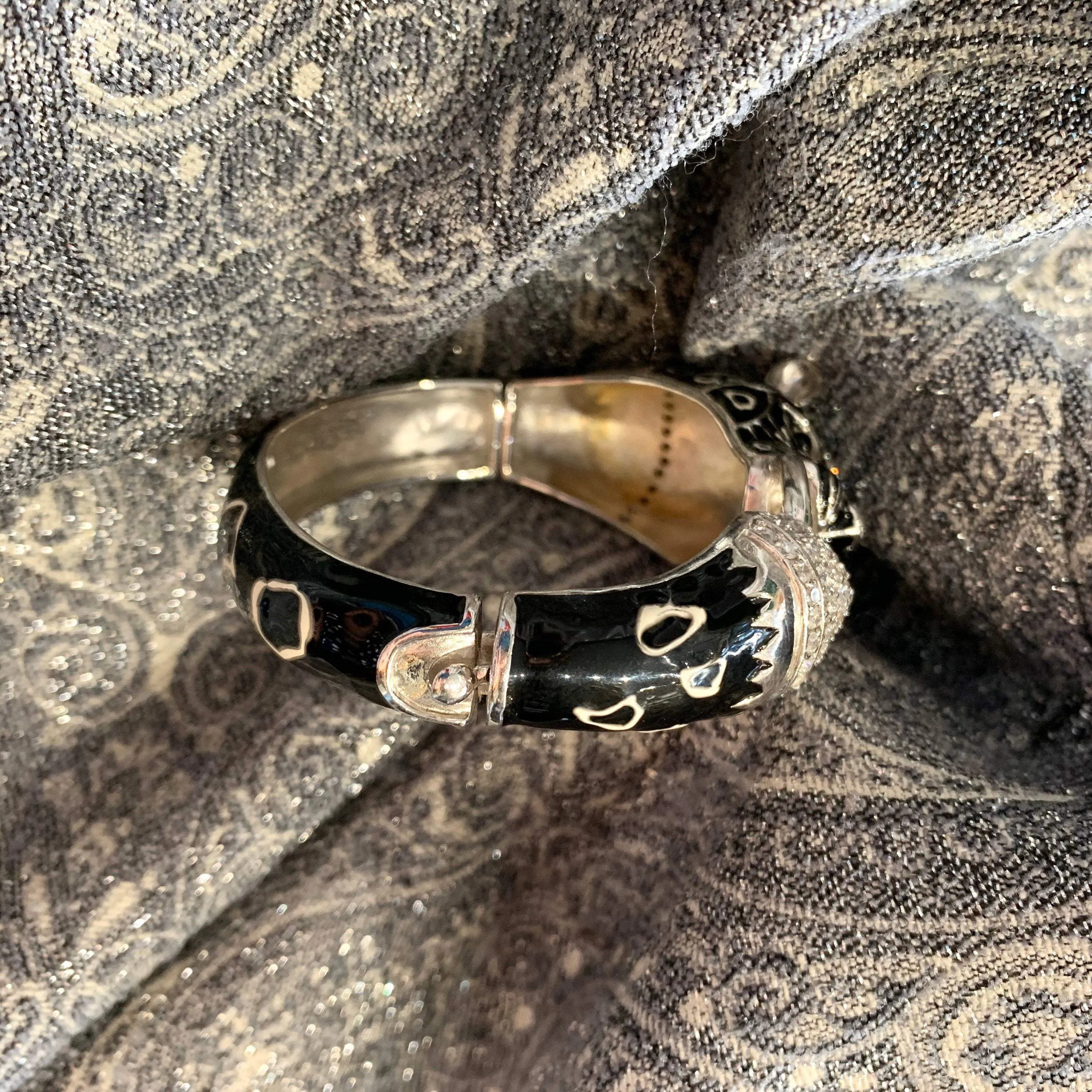 Black snow leopard cuff bracelet in silver enamel